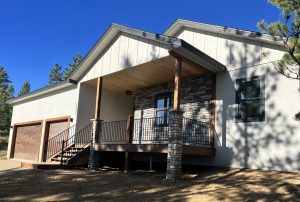 A beautiful entryway porch on a newly-built home includes exquisite stonework.